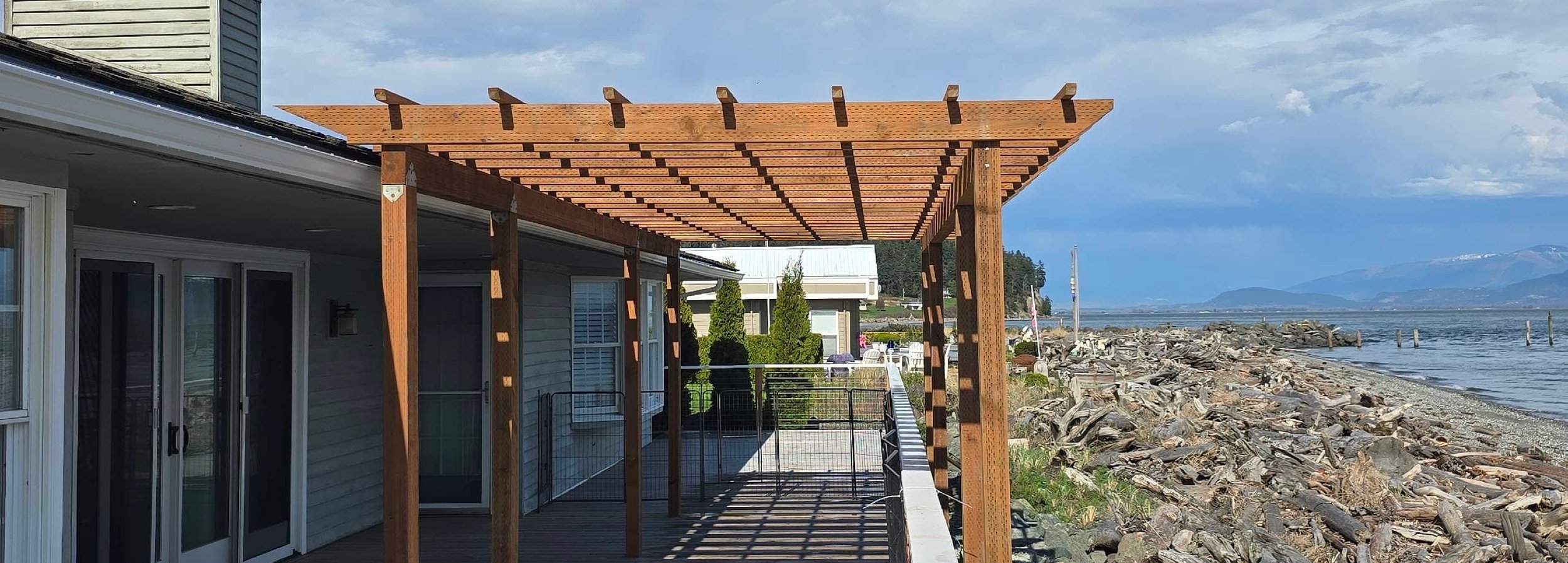 Waterfront deck with a cedar pergola on Whidbey Island