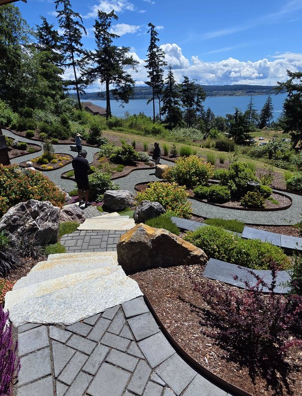 Hillside garden with stone paths overlooking the water on Whidbey Island